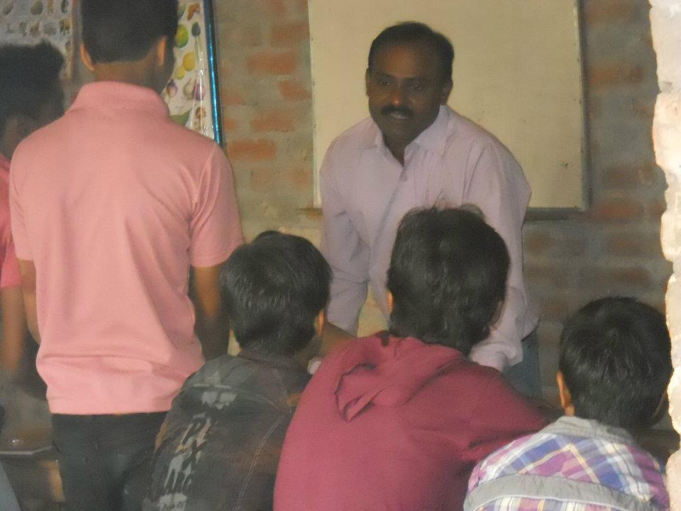 Mr. Rajesh teaching the students